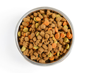 Dog food in bowl, isolated on white
