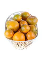 orange fruit in basket, isolated on white background