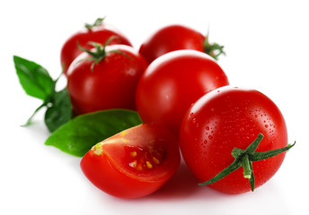 Cherry tomatoes with basil isolated on white