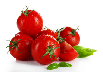 Cherry tomatoes with basil isolated on white