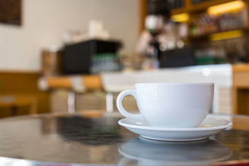 Coffee cup on table in cafe