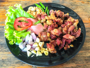 Fermented Chicken Tendons,thai food with wood background,