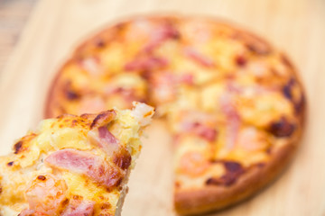 Pizza on wooden background