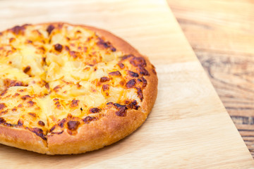 Pizza on wooden background