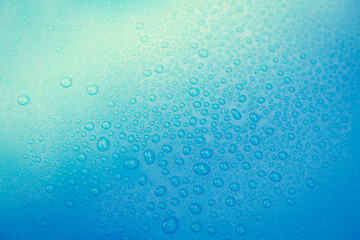 Drops of water on blue floor
