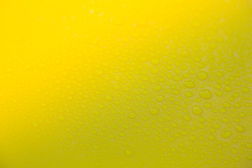 Drops of water on yellow floor