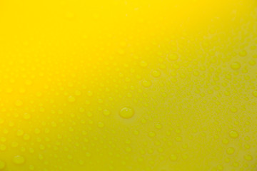 Drops of water on yellow floor