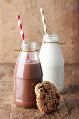 Fresh milk with drinking straw and cookies