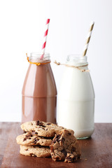 Fresh milk with drinking straw and cookies