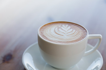 Latte Coffee art on the wooden table