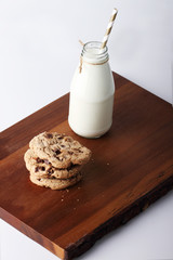 Fresh milk with drinking straw and cookies