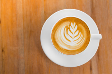 Latte Coffee art on the wooden table