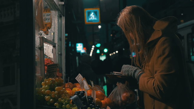 Woman Buying Fruit in Street Stall