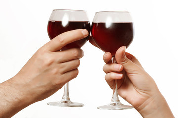 glasses of wine in a female and a male hand