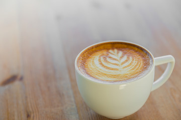 Latte Coffee art on the wooden table
