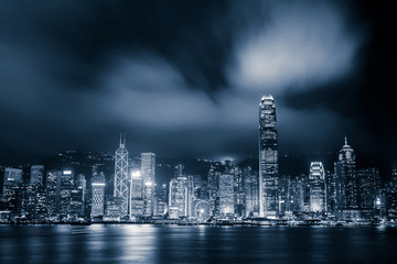 panoramic cityscape and skyline of hongkong harbor at night
