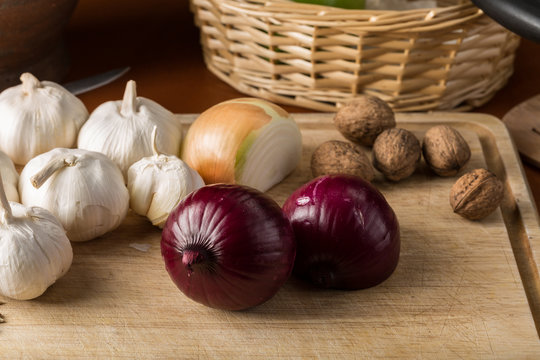 shallot, onion and garlic on cutting board