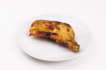 roasted chicken legs isolated on white background 