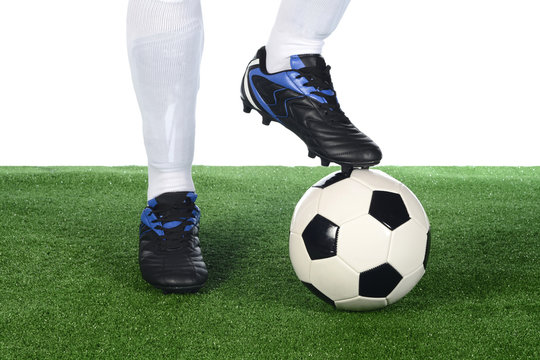 Jugador y bal&oacute;n de f&uacute;tbol, detalle