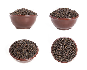Black pepper isolated on a white background. Pepper in a plate on a white background. Pepper set.