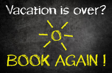 Vacation is Over, Book Again Concept on Blackboard