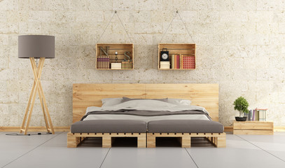 Modern bedroom with pallet bed on brick wall  - obrazy, fototapety, plakaty
