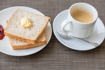 Breakfast with toast  and coffee.