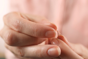 Closeup hands of seamstress at work