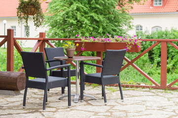 Fototapeta na wymiar Table and chairs of traditional european outdoor cafe