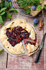 Rustic galette fruit tart with plums and cinnamon