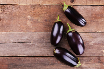 Fresh eggplant on wooden background