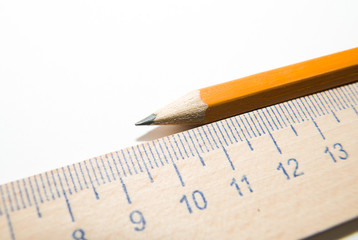 Notepads, pencil and wooden ruler on a white background