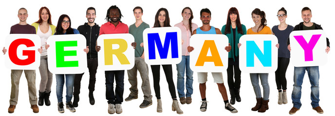 Group of young multi ethnic people holding word Germany