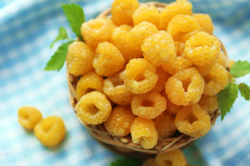 Yellow raspberries on checkered napkin, closeup