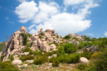 Fototapeta na wymiar Corsica island, rocky mountains under cloudy sky