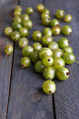 Green gooseberry on wooden background