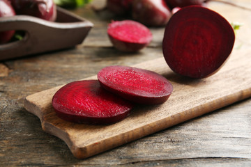 Young beets on wooden table close up