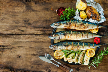 Grilled mackerel fish with baked potatoes