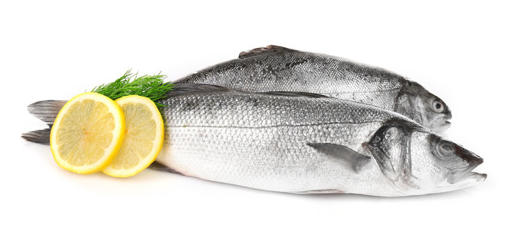 Fresh fish with dill and lemon isolated on white