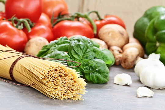 Uncooked Spaghetti and Ingredients for Sauce