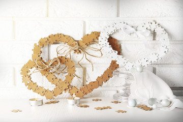 Puzzle made hearts shape on light background