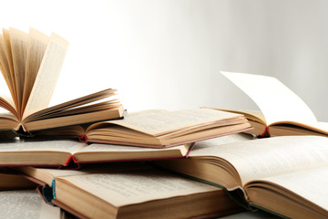 Many open books isolated on white