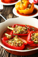 Red and yellow peppers stuffed with meat, rice and vegetables