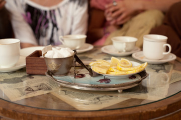 Vintage table with cups and lemon