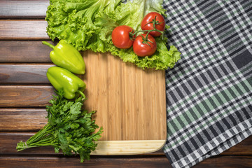 board with vegetables on the table
