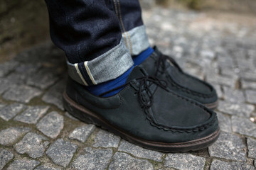 Confident man posing in selvedge  jeans