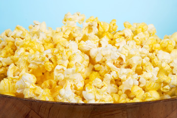 Hot Buttered Popcorn Snack – A bowl of freshly popped buttered popcorn.