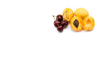 apricots and sweet cherries, isolated
