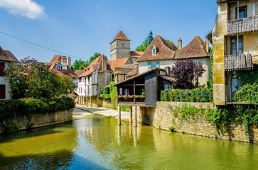 Fototapeta na wymiar River and buildings in Salies de Bearn, France.