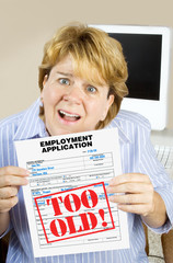 Disgusted Woman and Job Discrimination – A middle-aged worker is disgusted because her job...